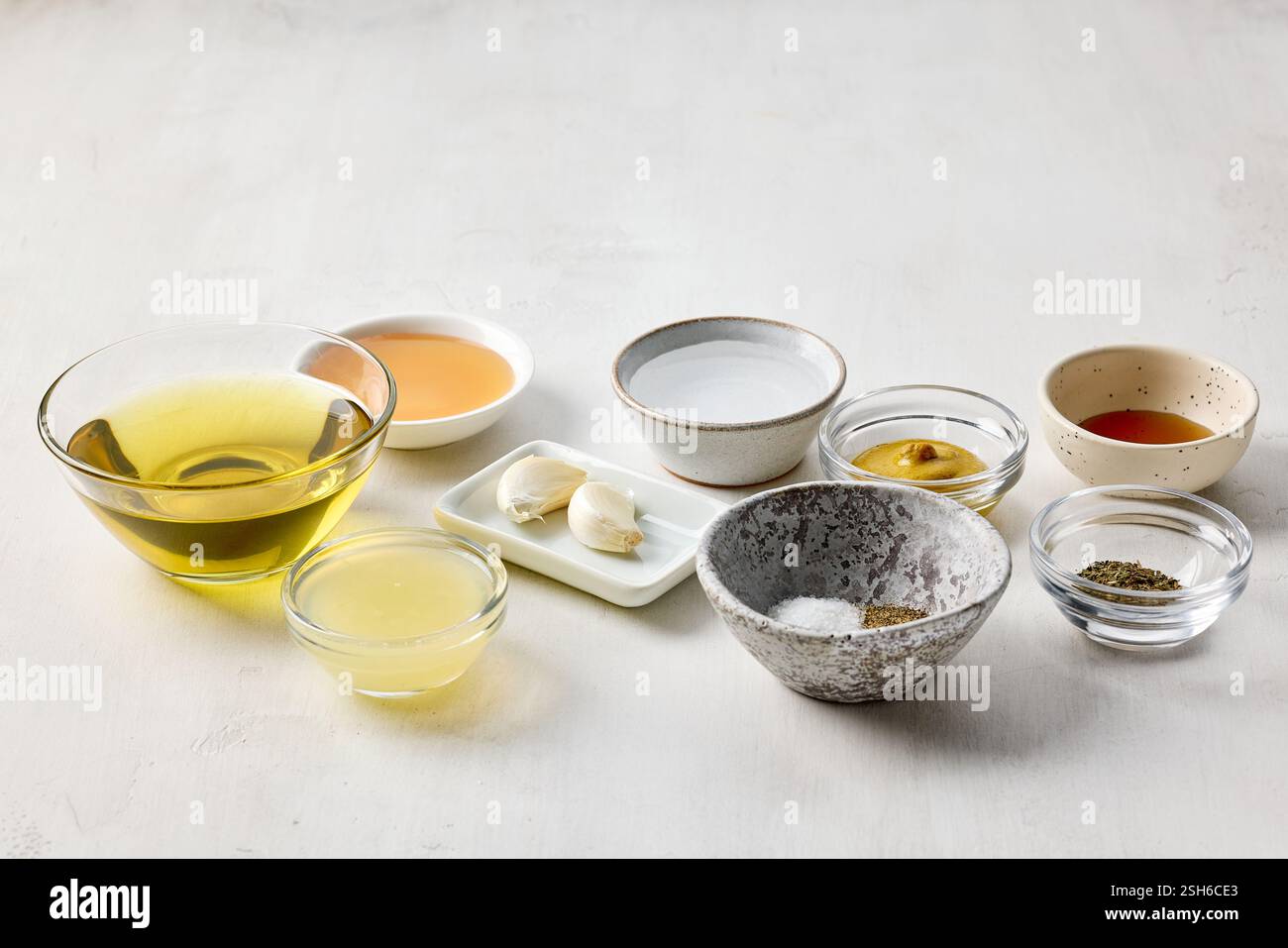 various salad dressing ingredients on white table background Stock Photo
