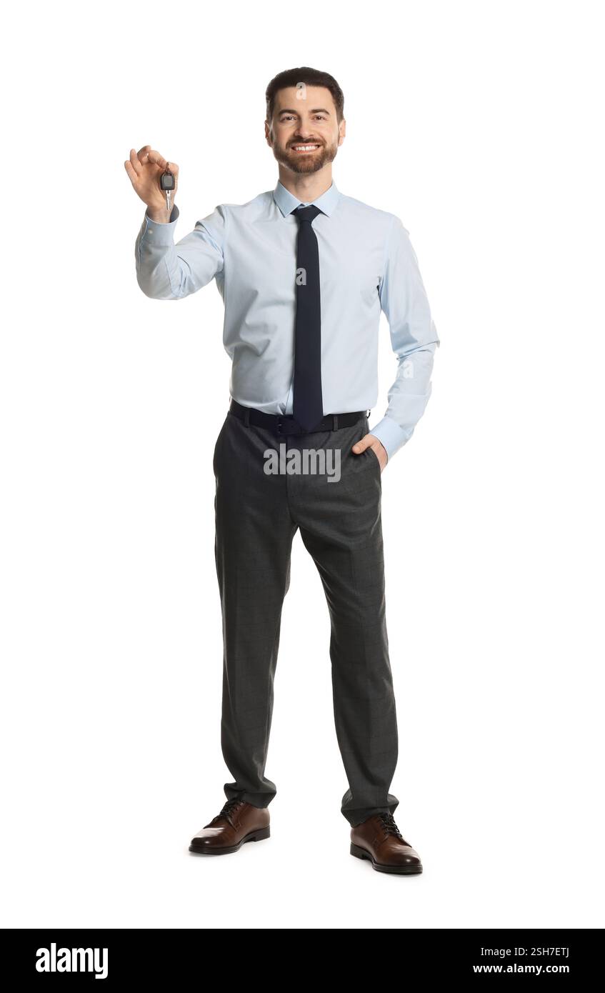 Cheerful salesman with car key on white background Stock Photo - Alamy
