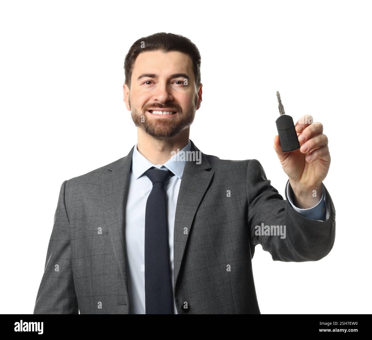 Cheerful salesman with car key on white background Stock Photo - Alamy
