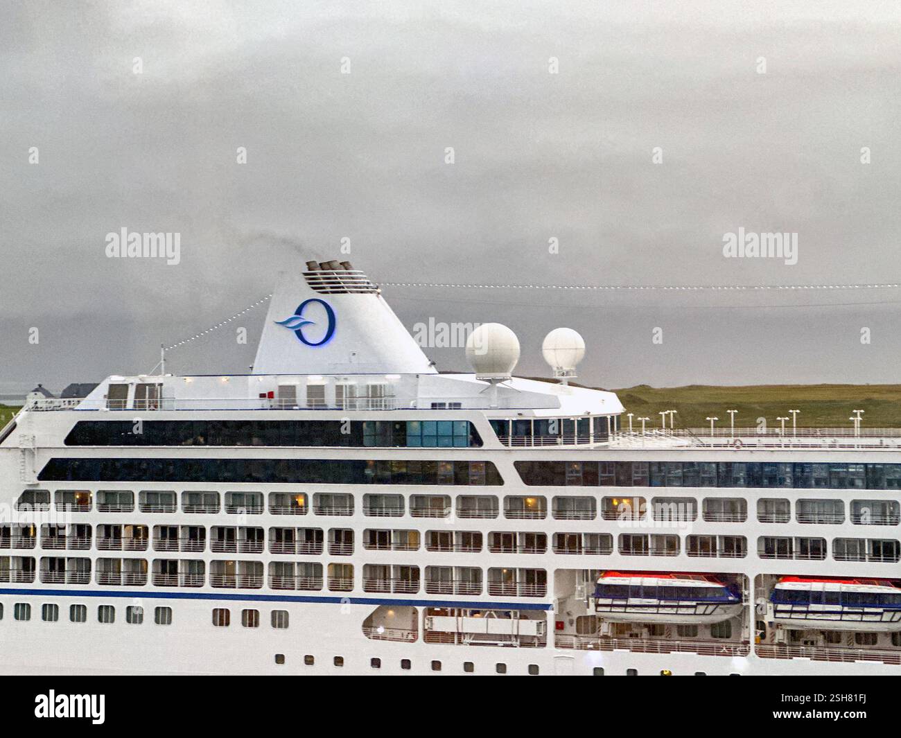 Reykjavík, Iceland - 22  August 2024: Close up view of the sdie of the cruise ship Nautica, which is operated by Oceania Cruises. - Smartphone Captured Stock Image