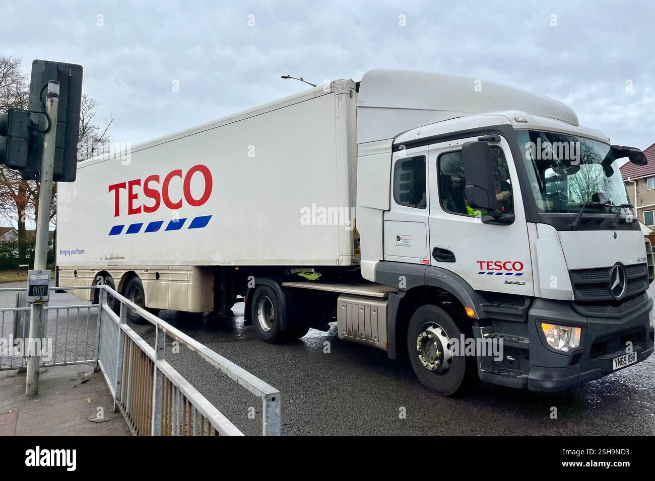Tesco Delivery Lorry driving through Sketty in Swansea, Wales, United Kingdom. 4th December 2024. - Smartphone Captured Stock Image