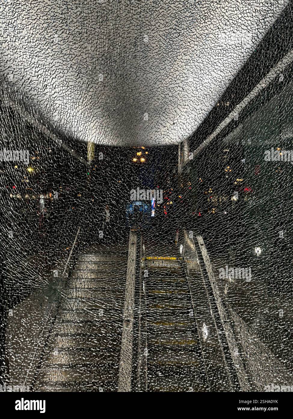 Broken plate glass at the Montgomery BART Station entrance on Market Street in San Francisco, California. - Smartphone Captured Stock Image