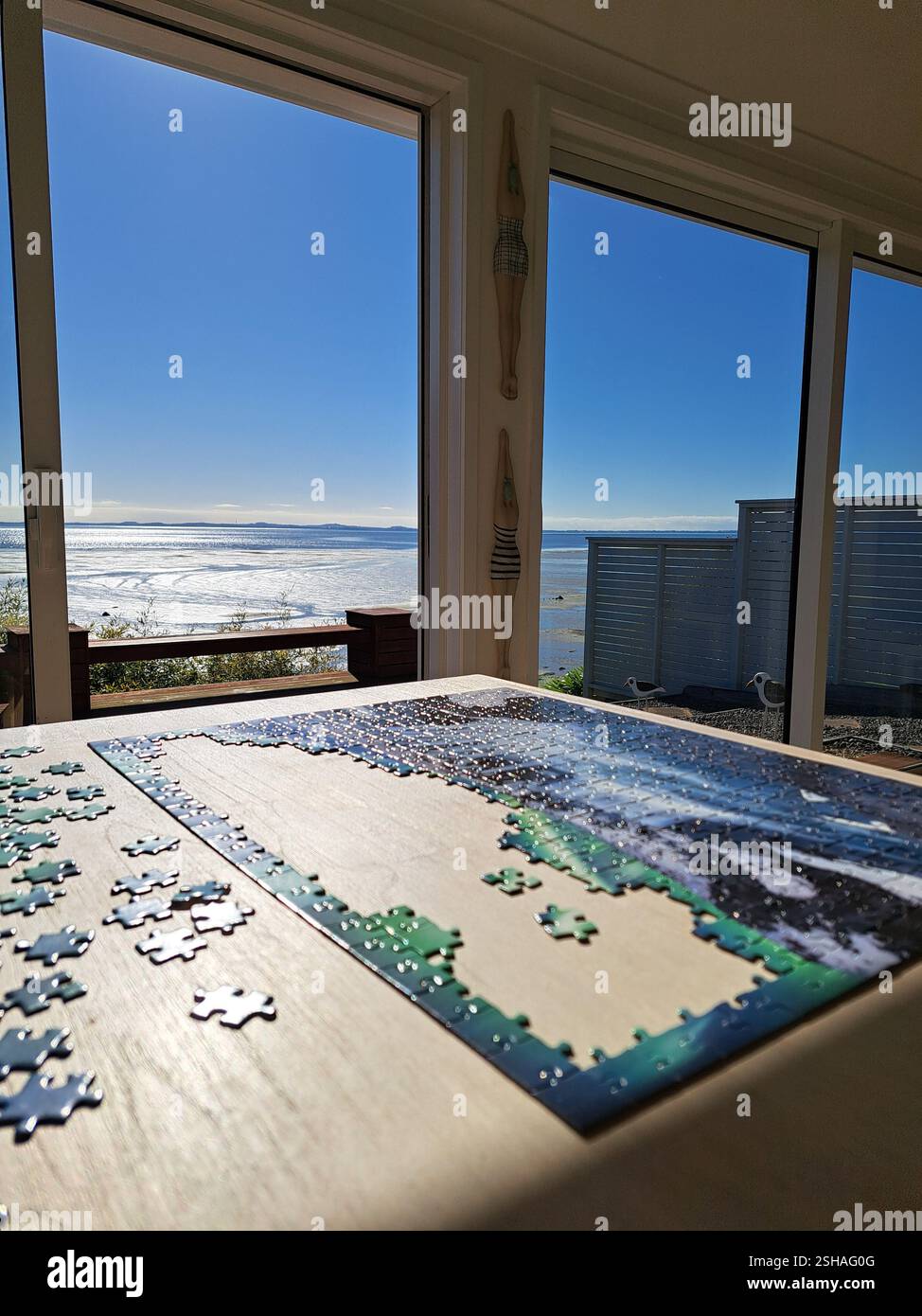 Puzzle time at the beach - Smartphone Captured Stock Image