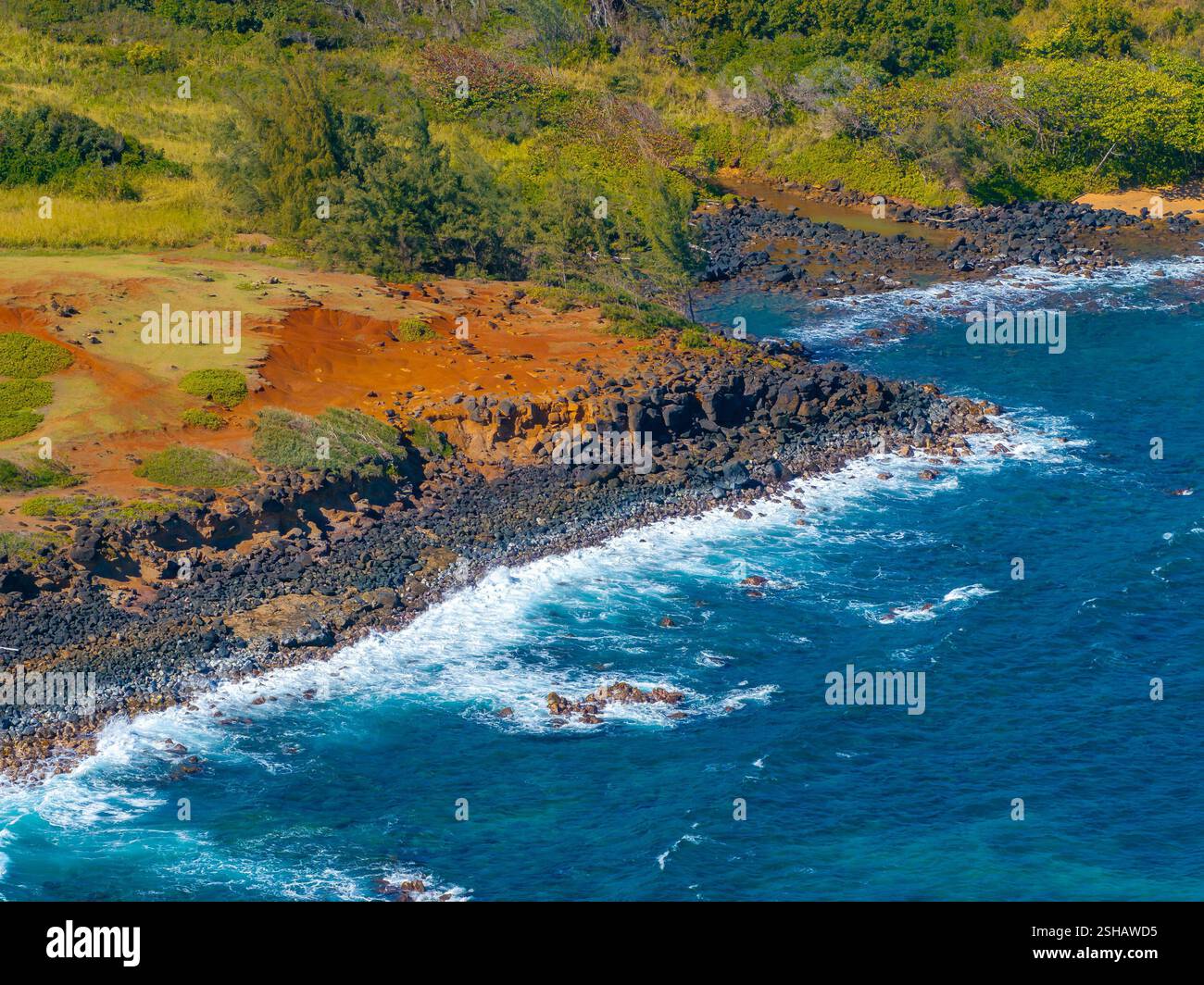 Rugged Red Cliffs and Ocean Waves on Kauai Island's Coastline Stock ...