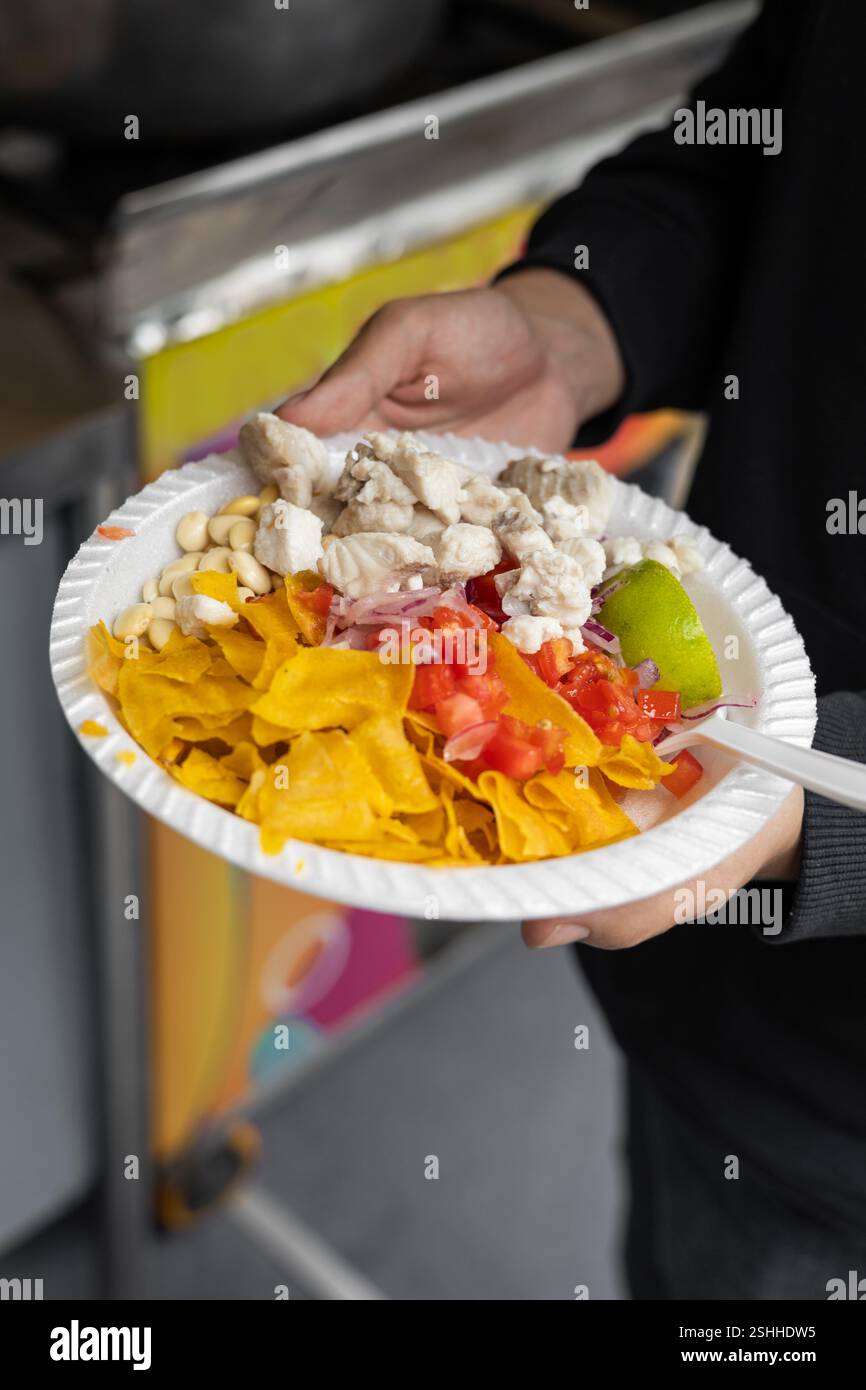 A delicious plate of Ecuadorian cevichocho, a unique dish made with chochos, vegetables, and seasonings, perfect for food, traditional cuisine, and Ec Stock Photo