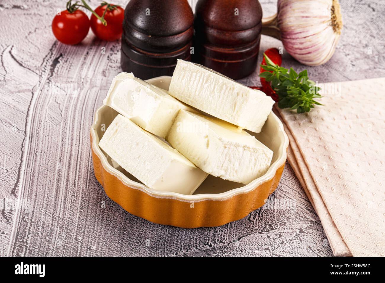 Greek traditional cuisine - Feta cheese bricks Stock Photo - Alamy