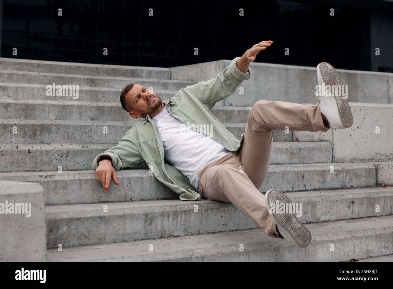 Man falling on stairs outdoors. Dangerous accident Stock Photo - Alamy