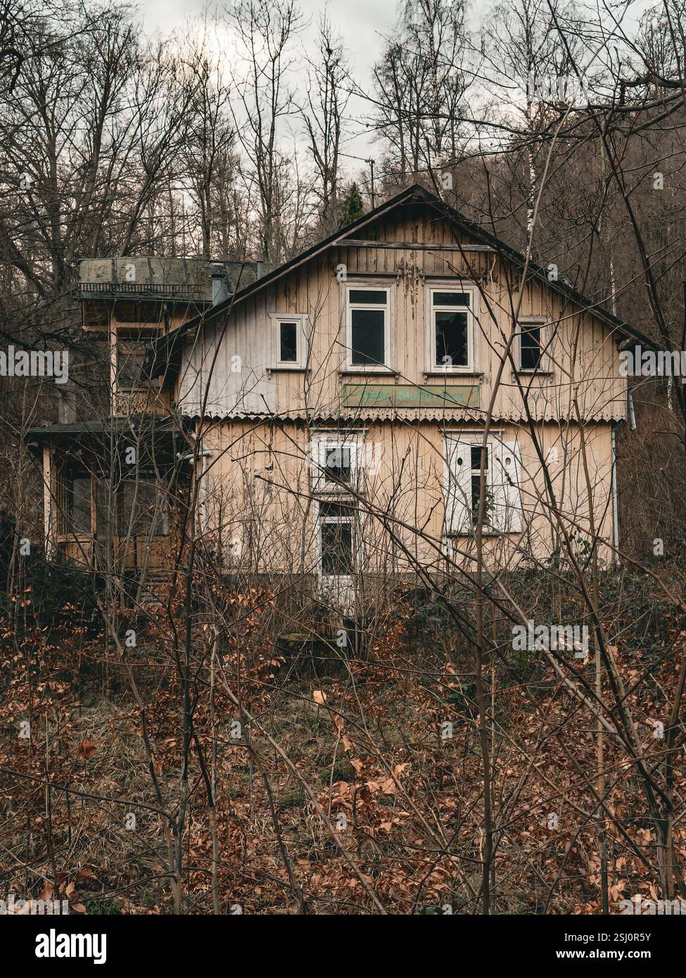Abandoned wooden house in the forest. Lost place in the Harz mountains in Germany. - Smartphone Captured Stock Image