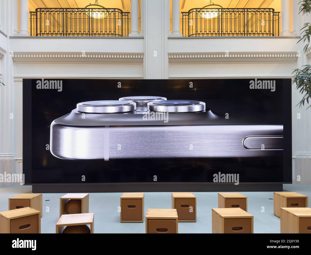 Inside Apple Store Amsterdam with new iPhone 15 Pro Max on screen. - Smartphone Captured Stock Image