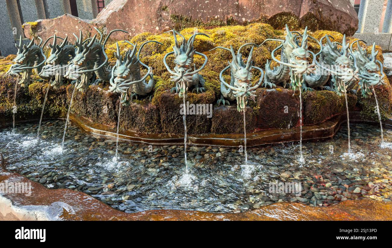 Nine-headed dragon fountain at Hakone Shrine on Lake Ashi, Hakone area of Kanagawa Prefecture in Honshū, Japan. - Smartphone Captured Stock Image