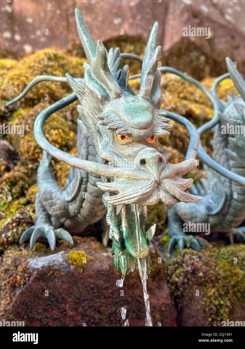 Nine-headed dragon fountain at Hakone Shrine on Lake Ashi, Hakone area of Kanagawa Prefecture in Honshū, Japan. - Smartphone Captured Stock Image