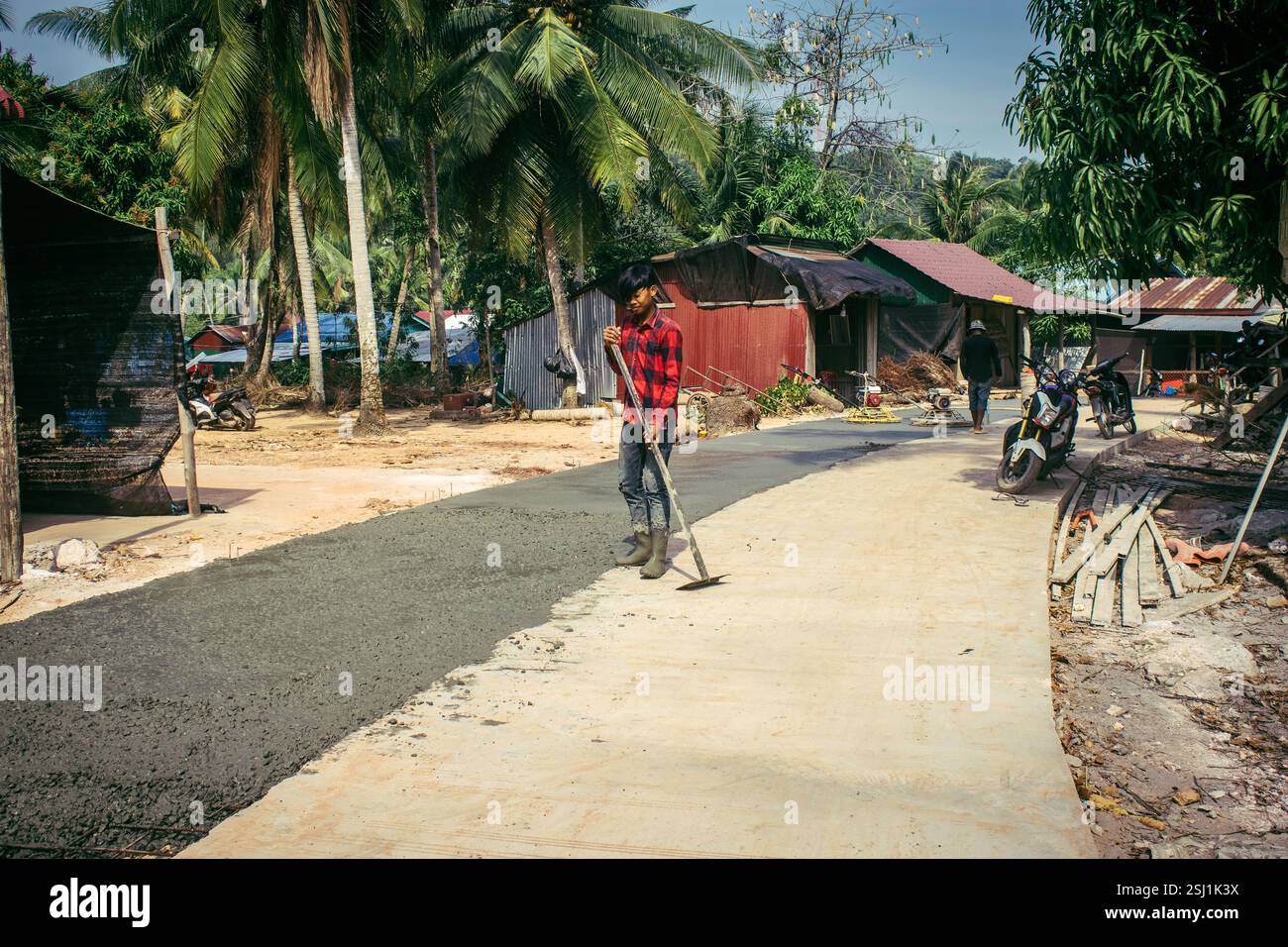 Local Roads Making Preak Svay, Koh Rong Island, Cambodia, February 6, 2025 Local people ...
