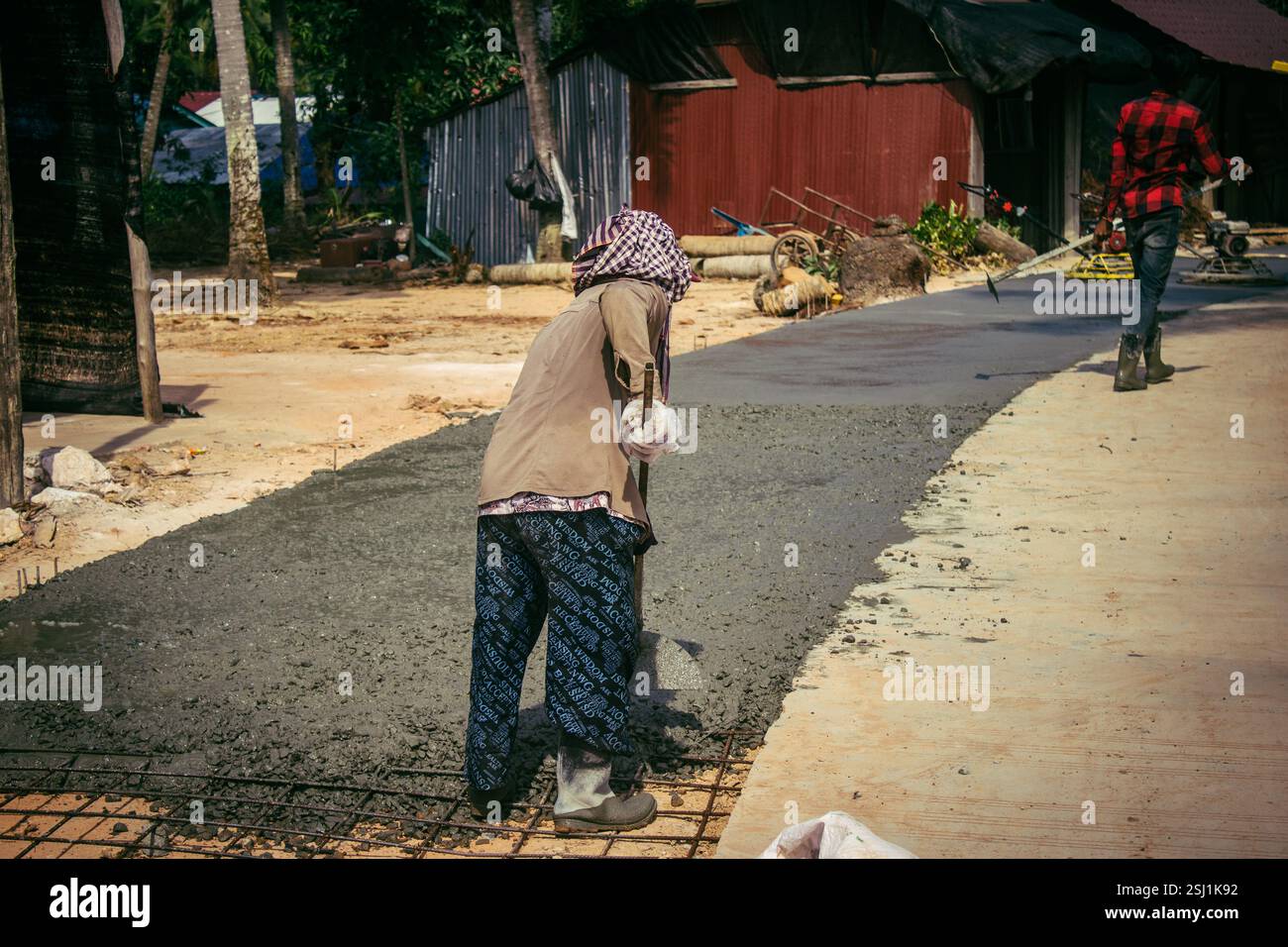 Local Roads Making Preak Svay, Koh Rong Island, Cambodia, February 6, 2025 Local people ...