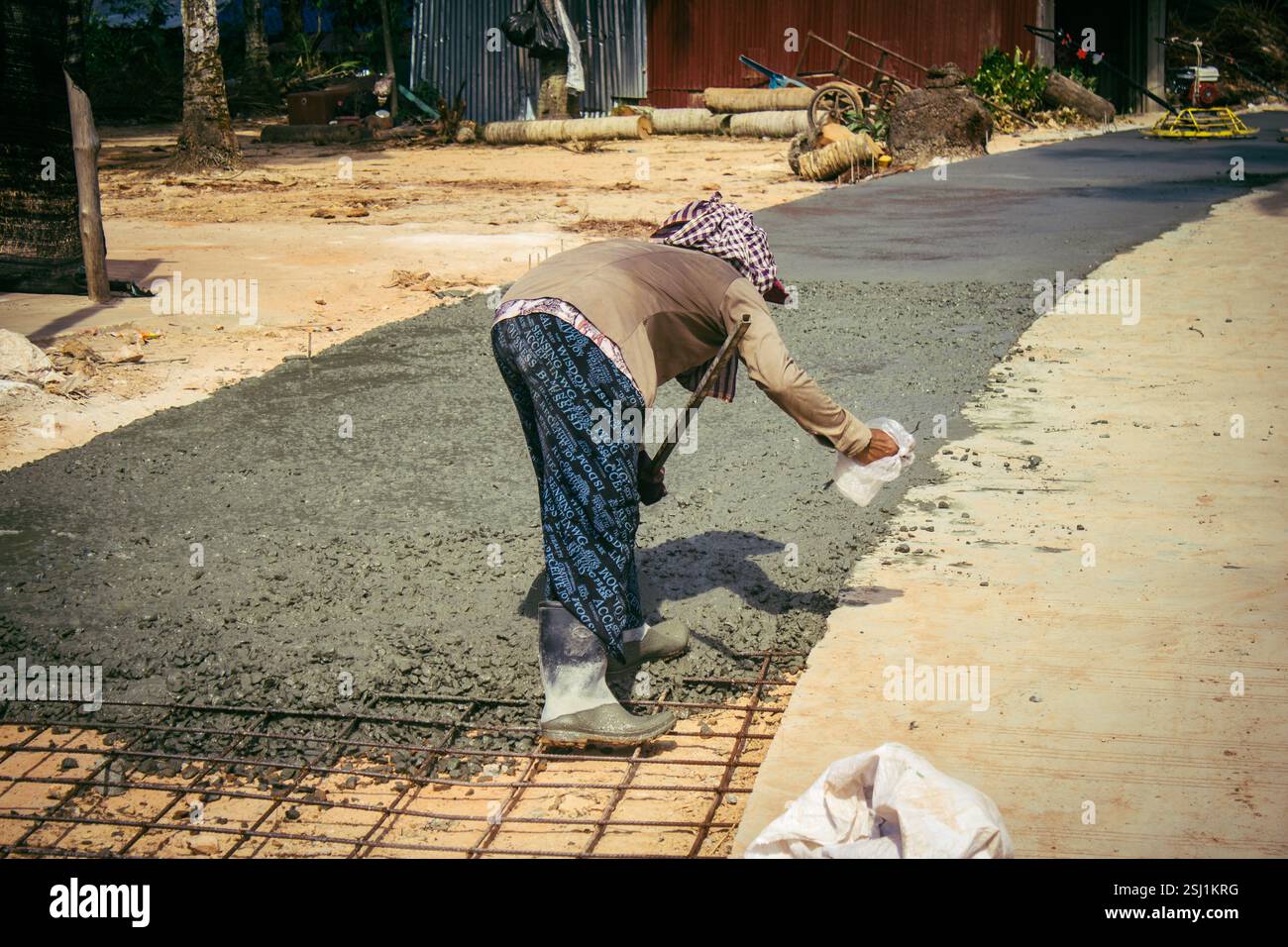 Local Roads Making Preak Svay, Koh Rong Island, Cambodia, February 6, 2025 Local people ...