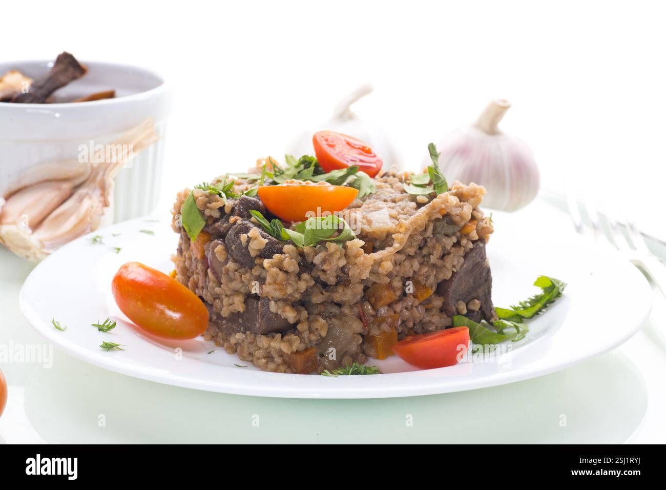 Bulgerty Eatable cooked dinner with bulgur and vegetables isolated on white background ...