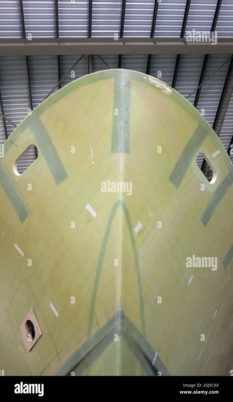 Shipbuilding Industry. Glass fiber hull of a yacht being build at the ...