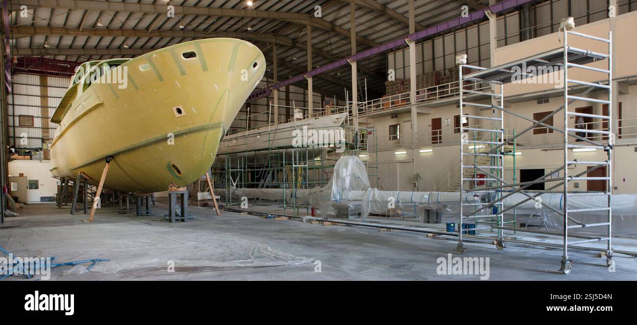 Shipbuilding Industry. Glass fiber hull of a yacht being build at the ...