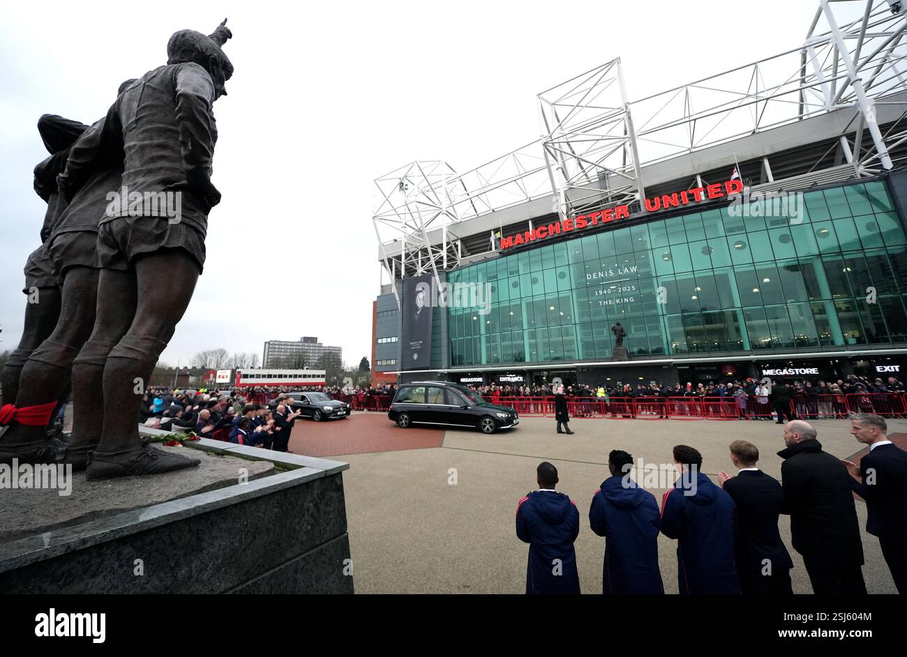 Processional Trafford The funeral procession for Denis Law passes the Trinity Statue outside ...