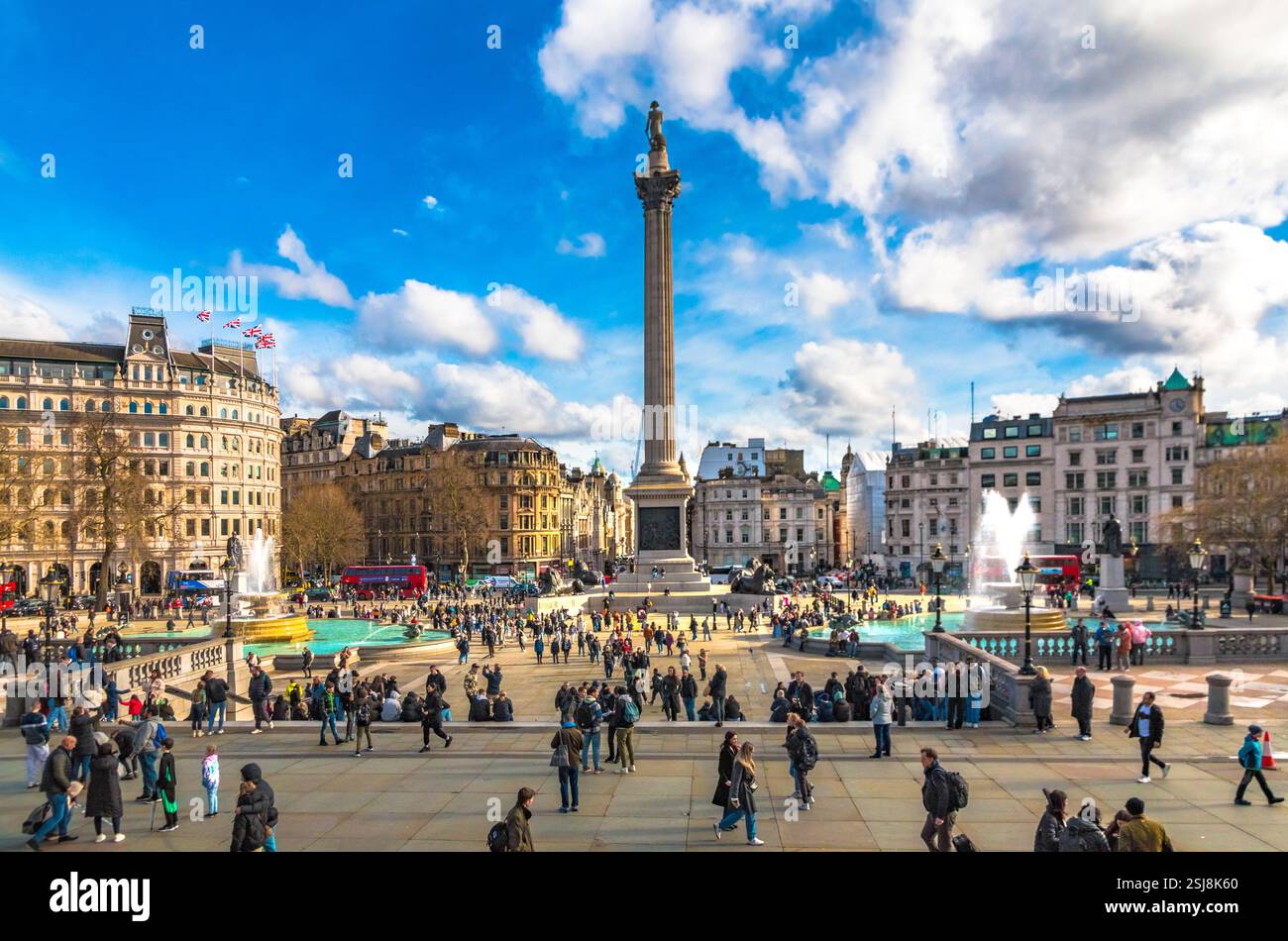 Overlooking Trafalgar Square, the renowned monument Nelson's Column at its centre, commemorating Vice-Admiral Horatio Nelson, on a bustling day in the... Stock Photo