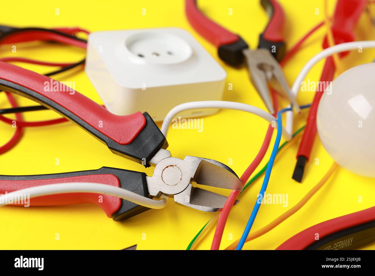 Different electrical tools on yellow background, closeup Stock Photo ...