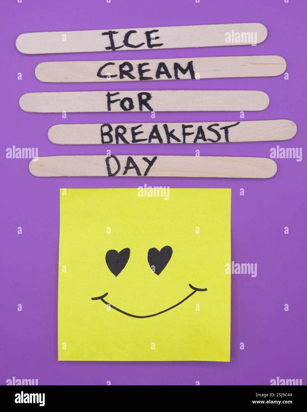 A concept of handwritten popsicle sticks on a purple background and a ...