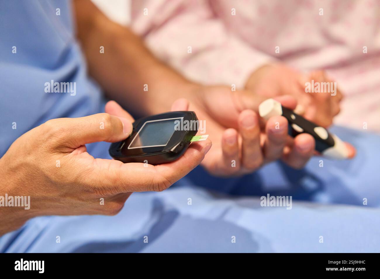 A detailed shot depicting individuals holding a glucometer and lancet test device. Highlighting medical care, blood sugar monitoring, and diabetes hea Stock Photo