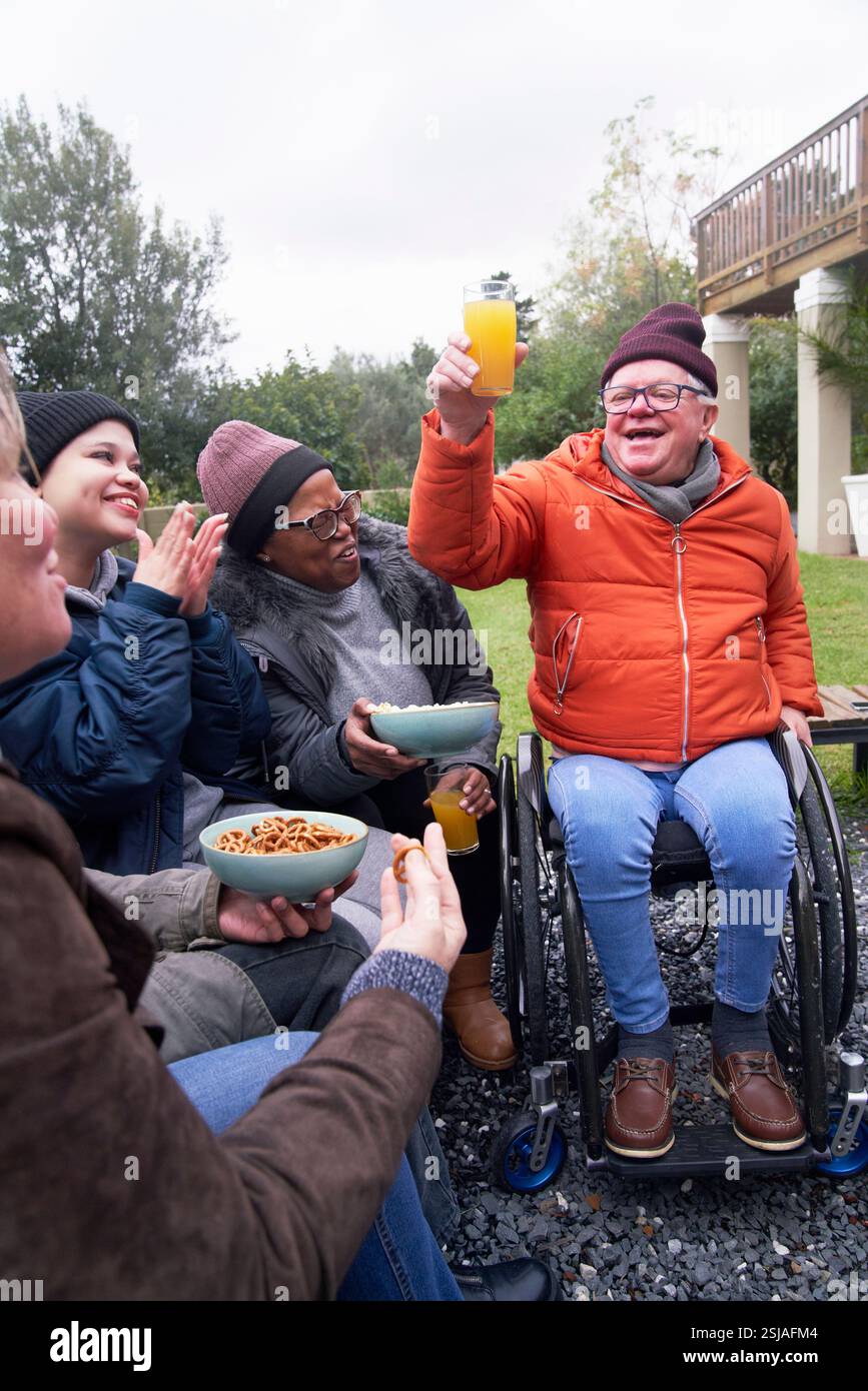 Smiling friends in garden Stock Photo