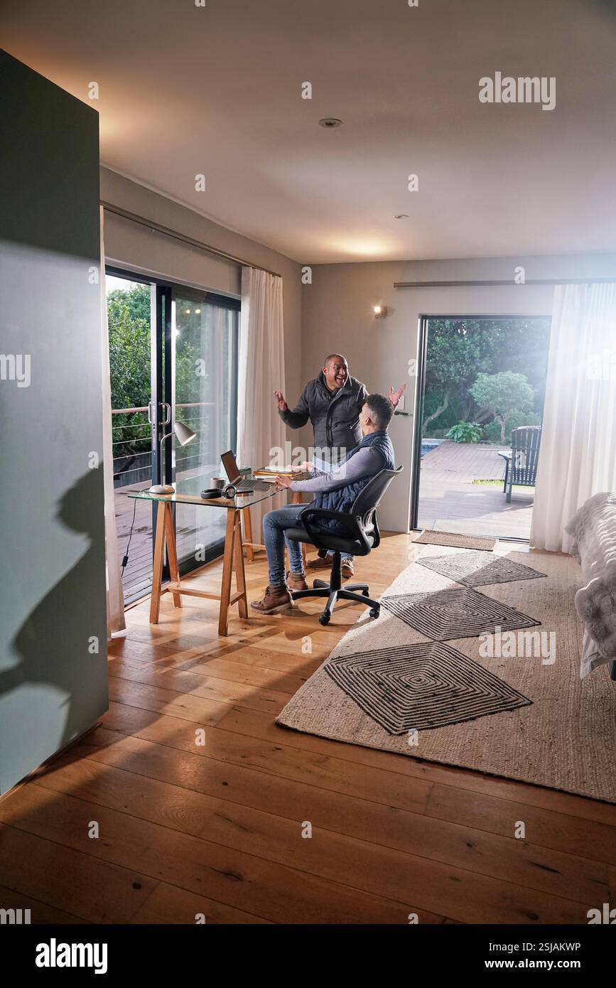 Gay couple using laptop Stock Photo