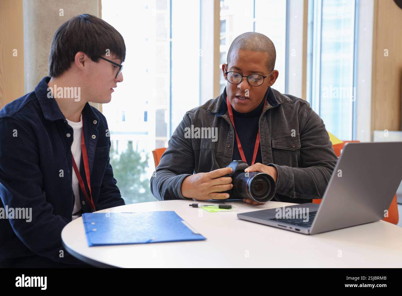 Man with Down Syndrome at photography class Stock Photo