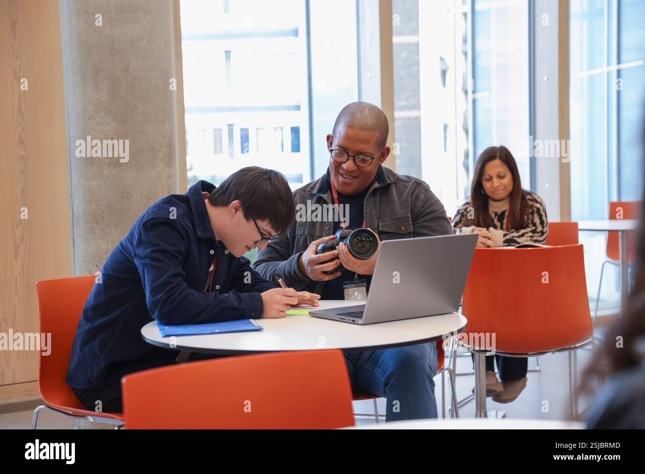 Man with Down Syndrome at photography class Stock Photo