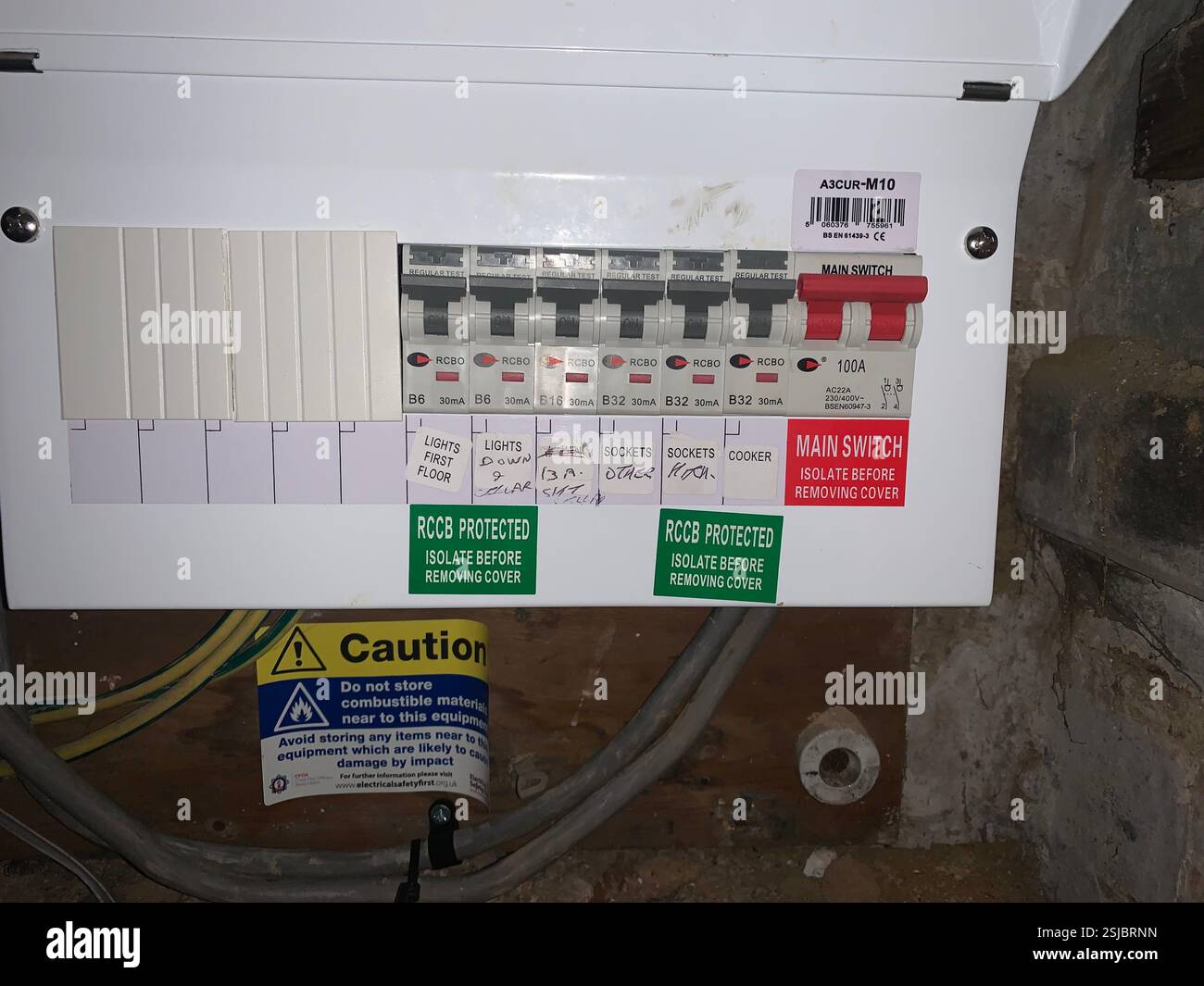 Electrical Electric mains consumer unit white signs sign stickers British English UK RCBO RCBOS  main switch power box spares spare blanks blank - Smartphone Captured Stock Image