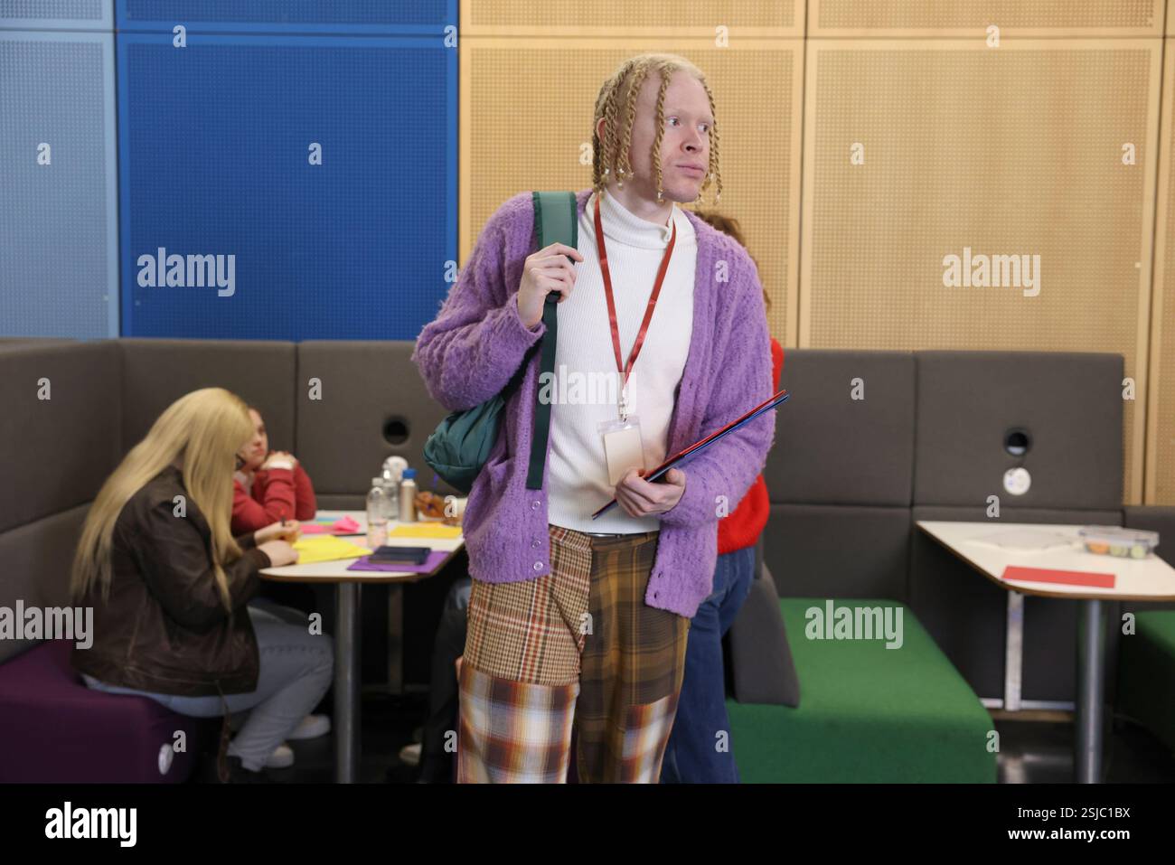 Man standing in community center Stock Photo