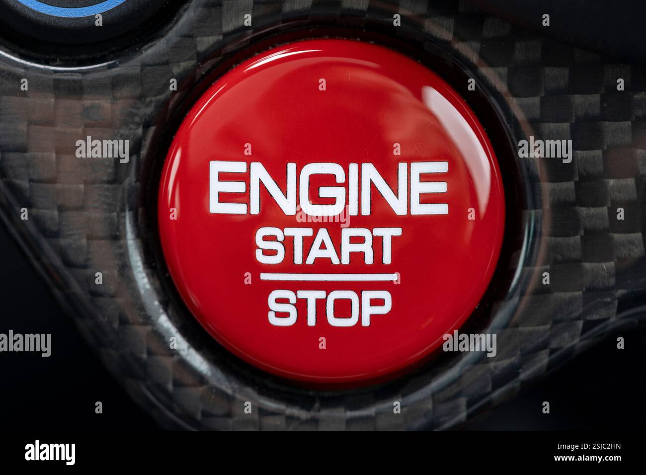Ferrari start and stop engine button in a luxury supercar Stock Photo