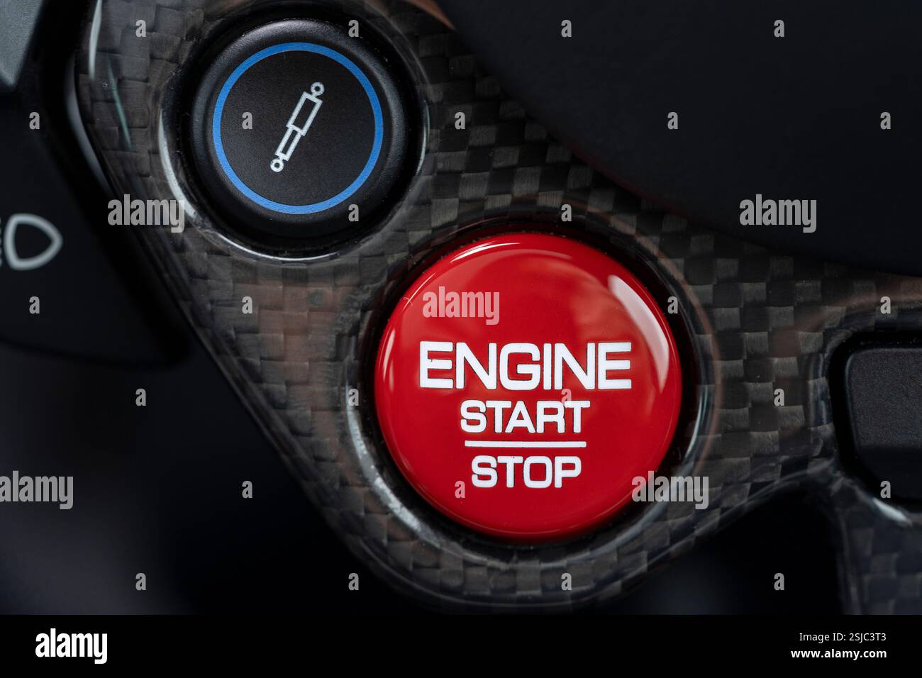 Ferrari start and stop engine button in a luxury supercar Stock Photo