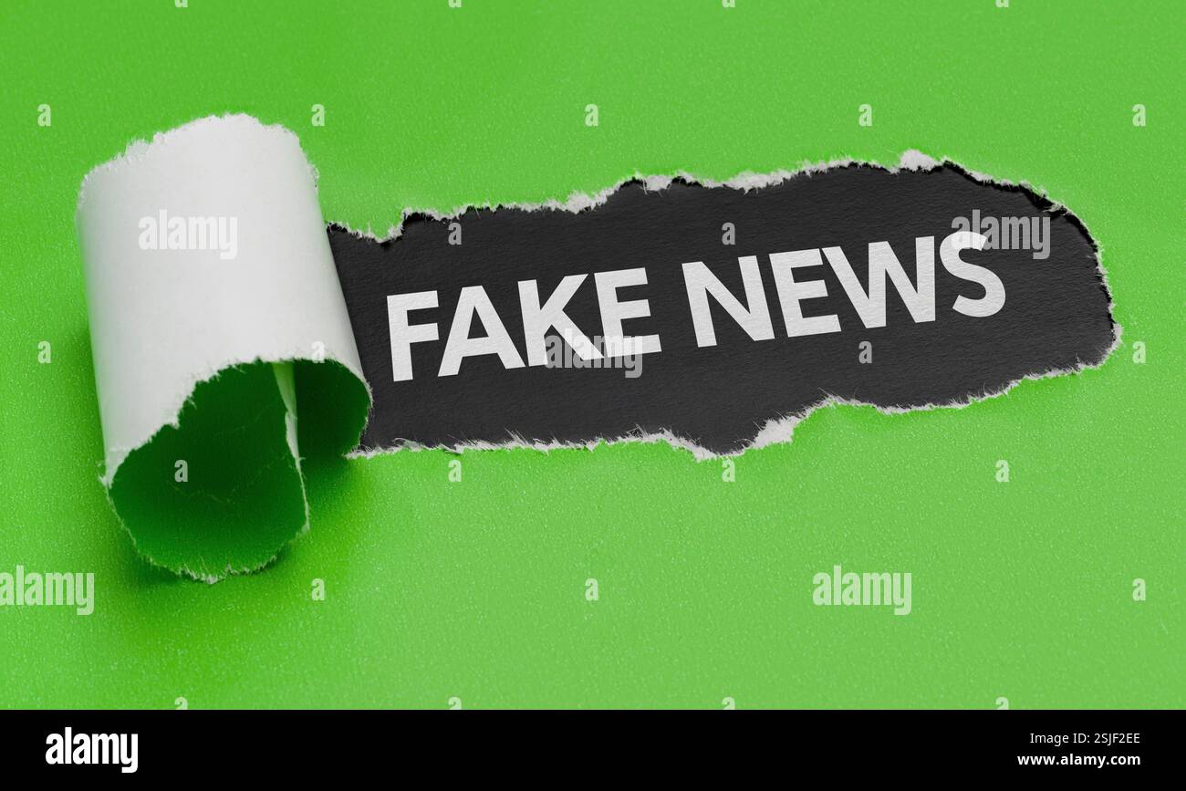 Torn paper - fake news Stock Photo