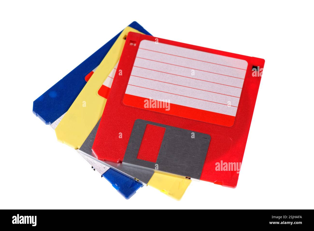 A stack of vintage computer colored floppy disks Isolated on white. Old technologies. Selective focus Stock Photo