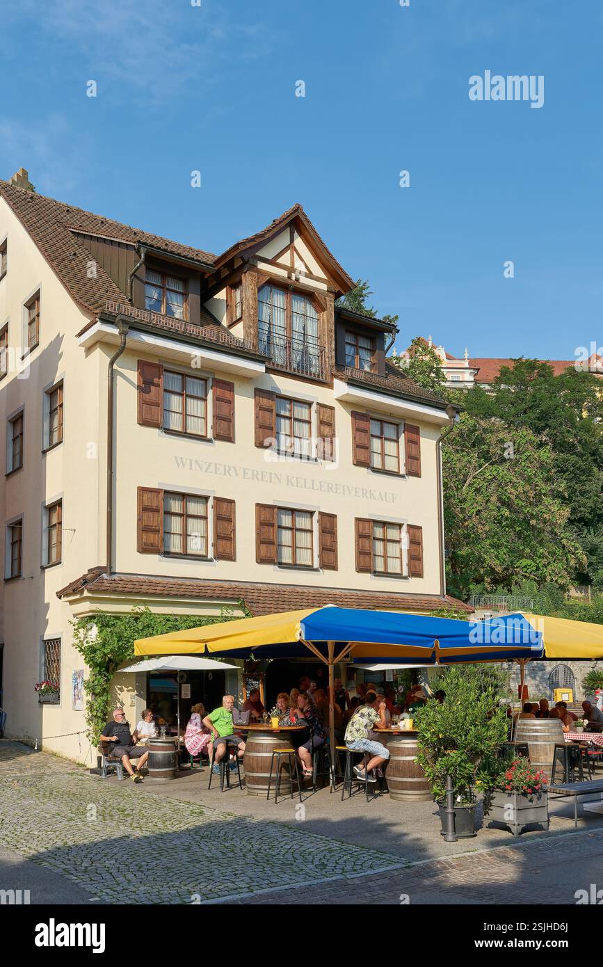 Tourists in a typical traditional wine tavern in the old town of ...
