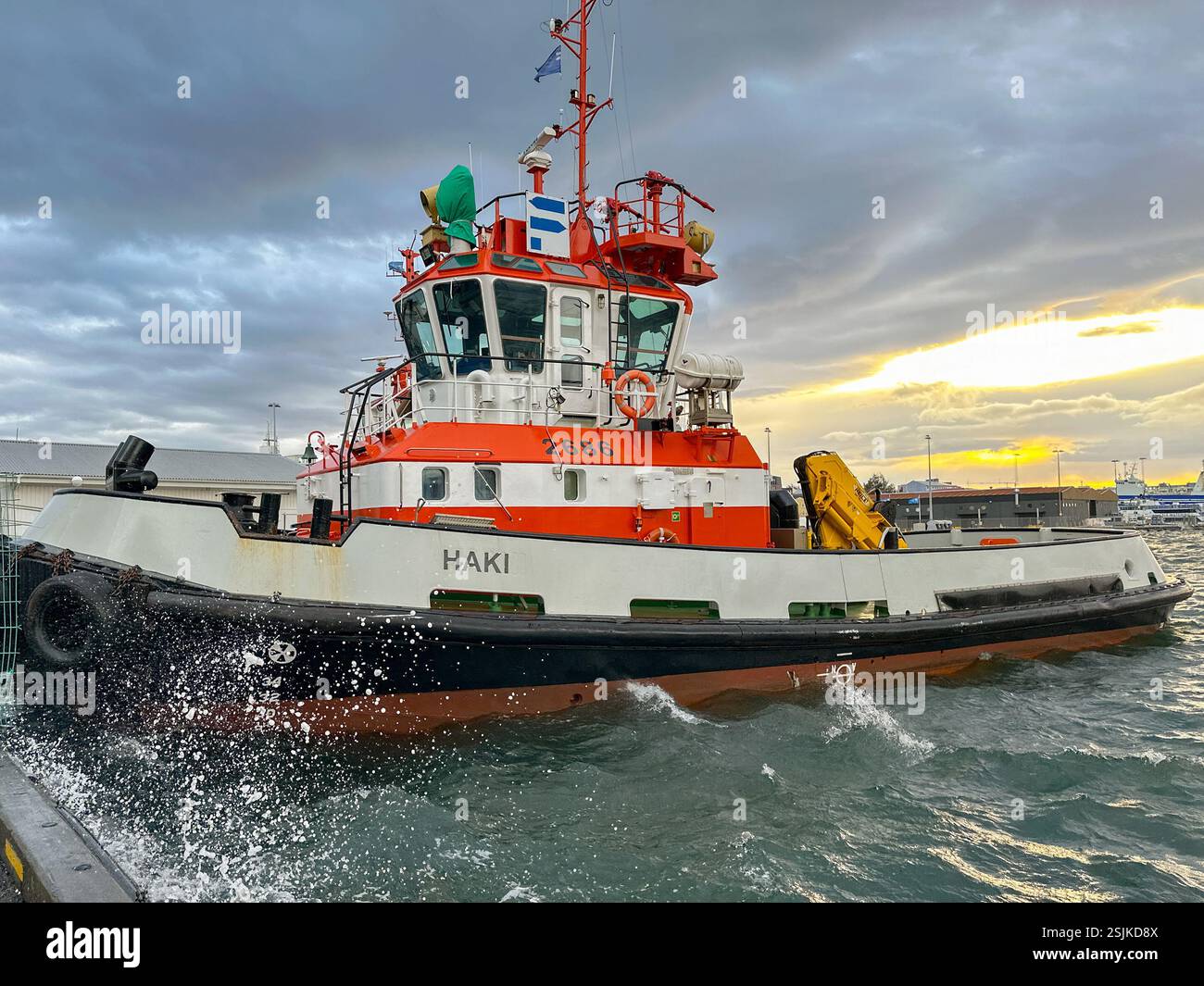 Reykjavík, Iceland - 21 August 2024: Tug boat moored in the  port of Reykjavík with choppy water - Smartphone Captured Stock Image
