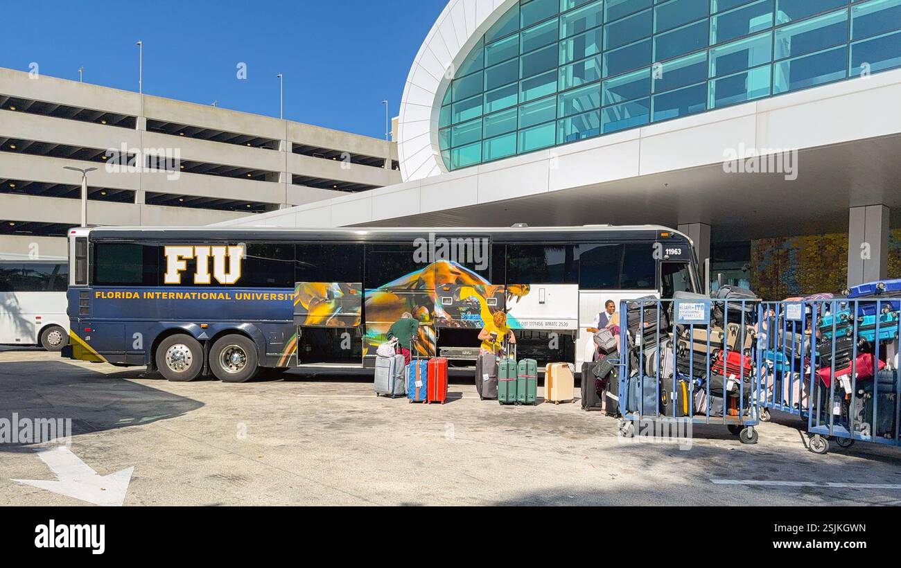 Miami, Florida, USA - 4 January 2024: Luggage being unloaded from a tour bus at the Norwegian Cruise Line terminal in the Port of Miami. - Smartphone Captured Stock Image