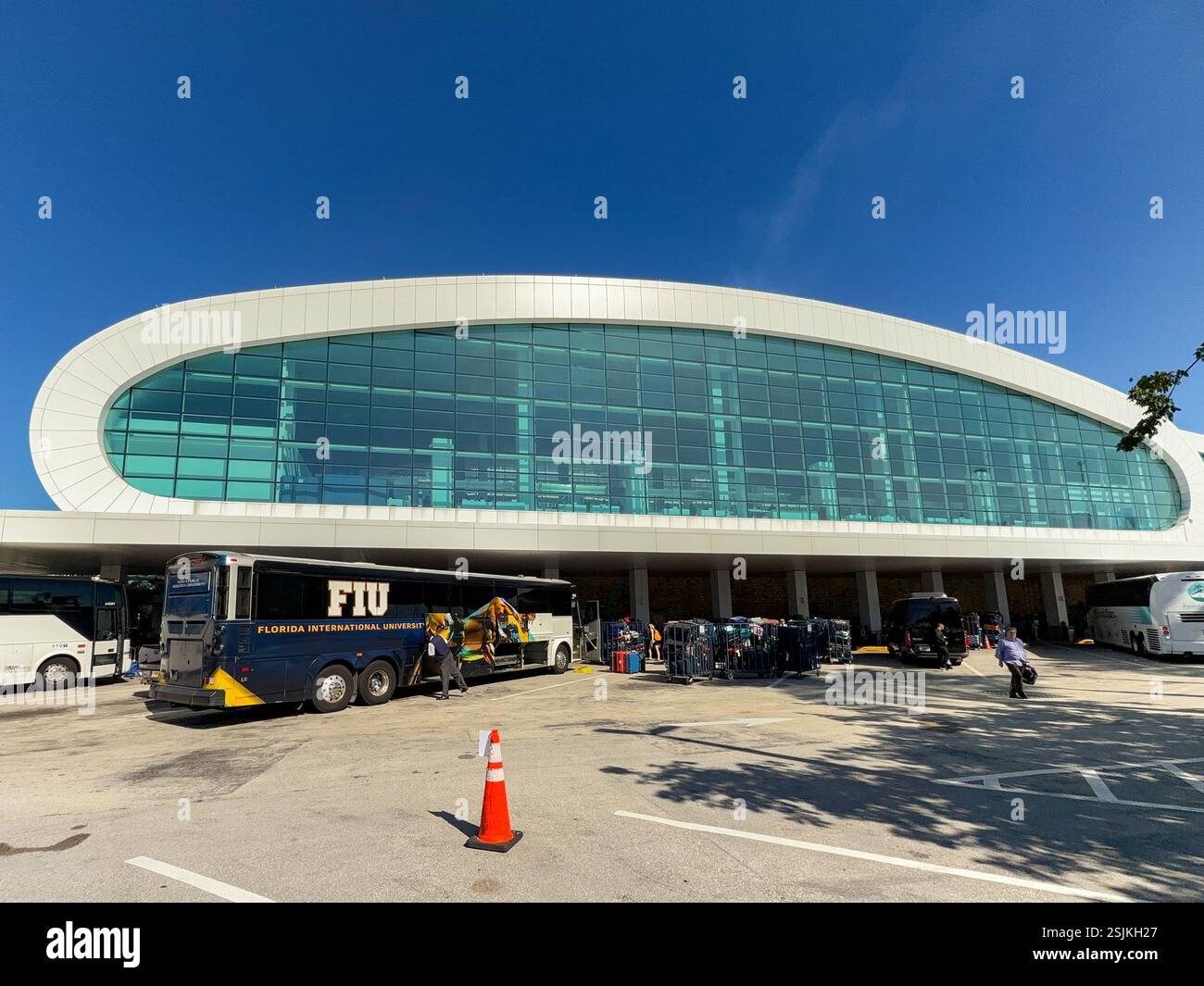 Miami, Florida, USA - 4 January 2024: Luggage being unloaded from a tour bus at the Norwegian Cruise Line terminal in the Port of Miami. - Smartphone Captured Stock Image