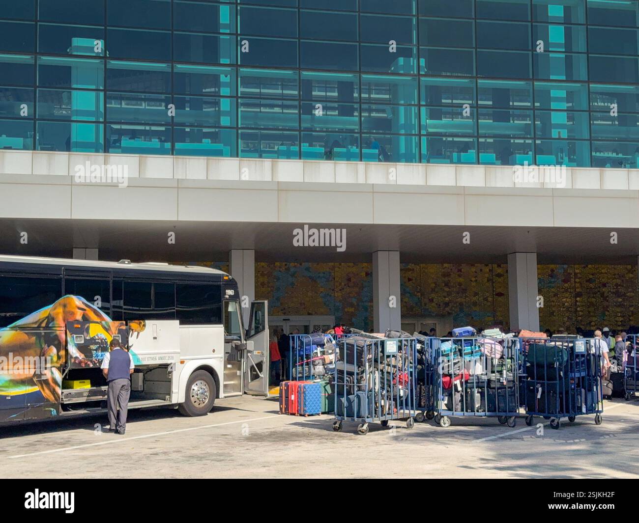 Miami, Florida, USA - 4 January 2024: Luggage being unloaded from a tour bus at the Norwegian Cruise Line terminal in the Port of Miami. - Smartphone Captured Stock Image