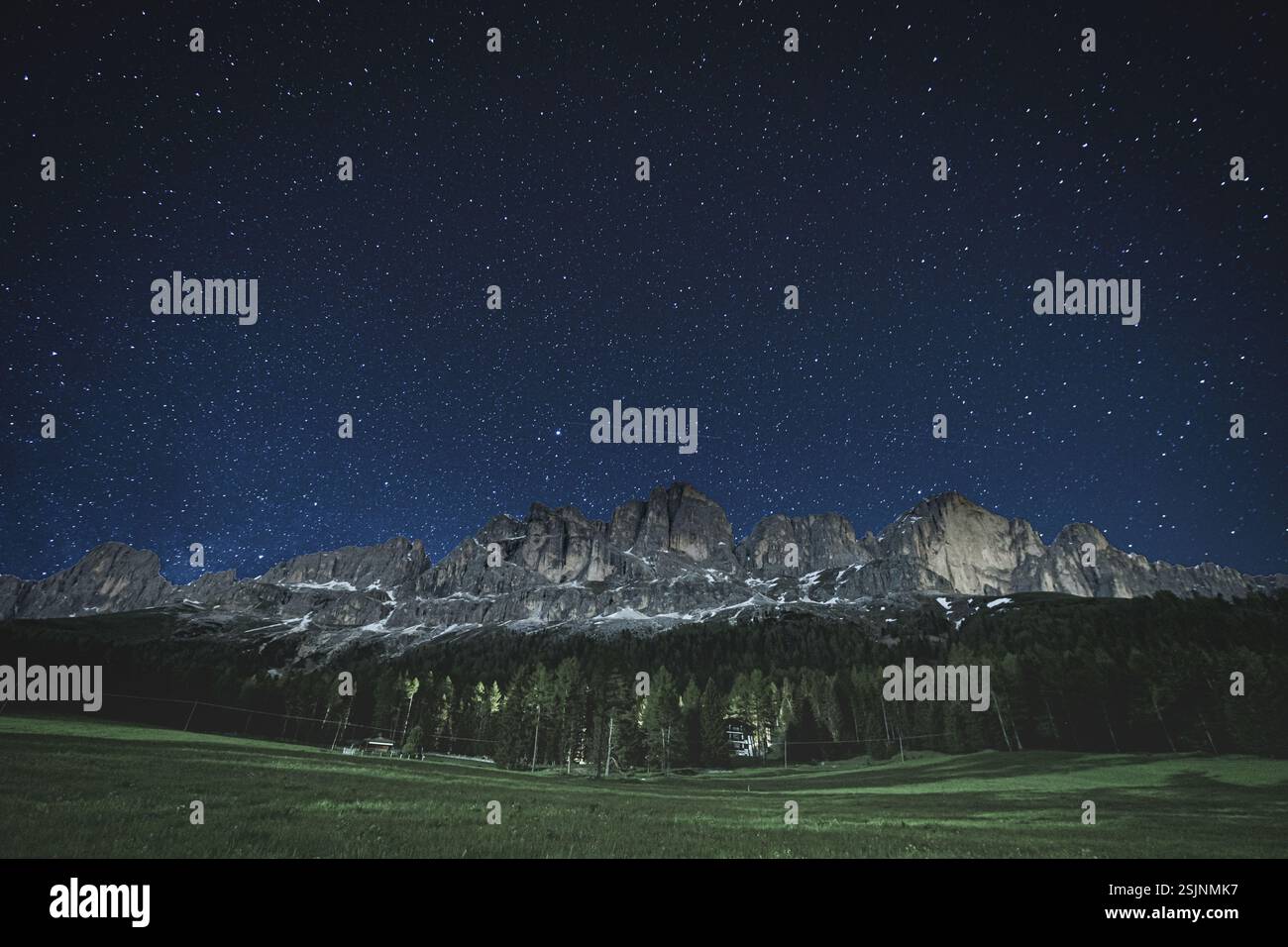 Starry sky above Dolomites Catinaccio Rosengarten Stock Photo
