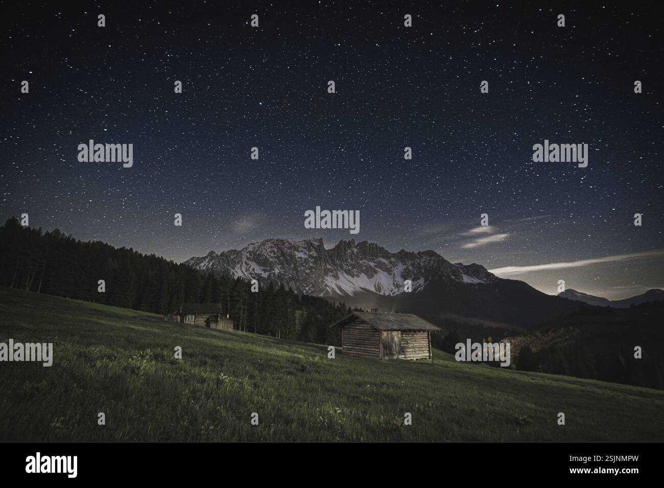 Dolomites Latemar under starry sky during summer Stock Photo
