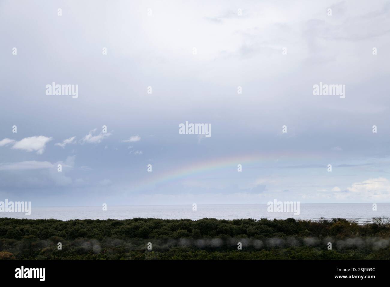 Rainbow in the sky over Juist Stock Photo