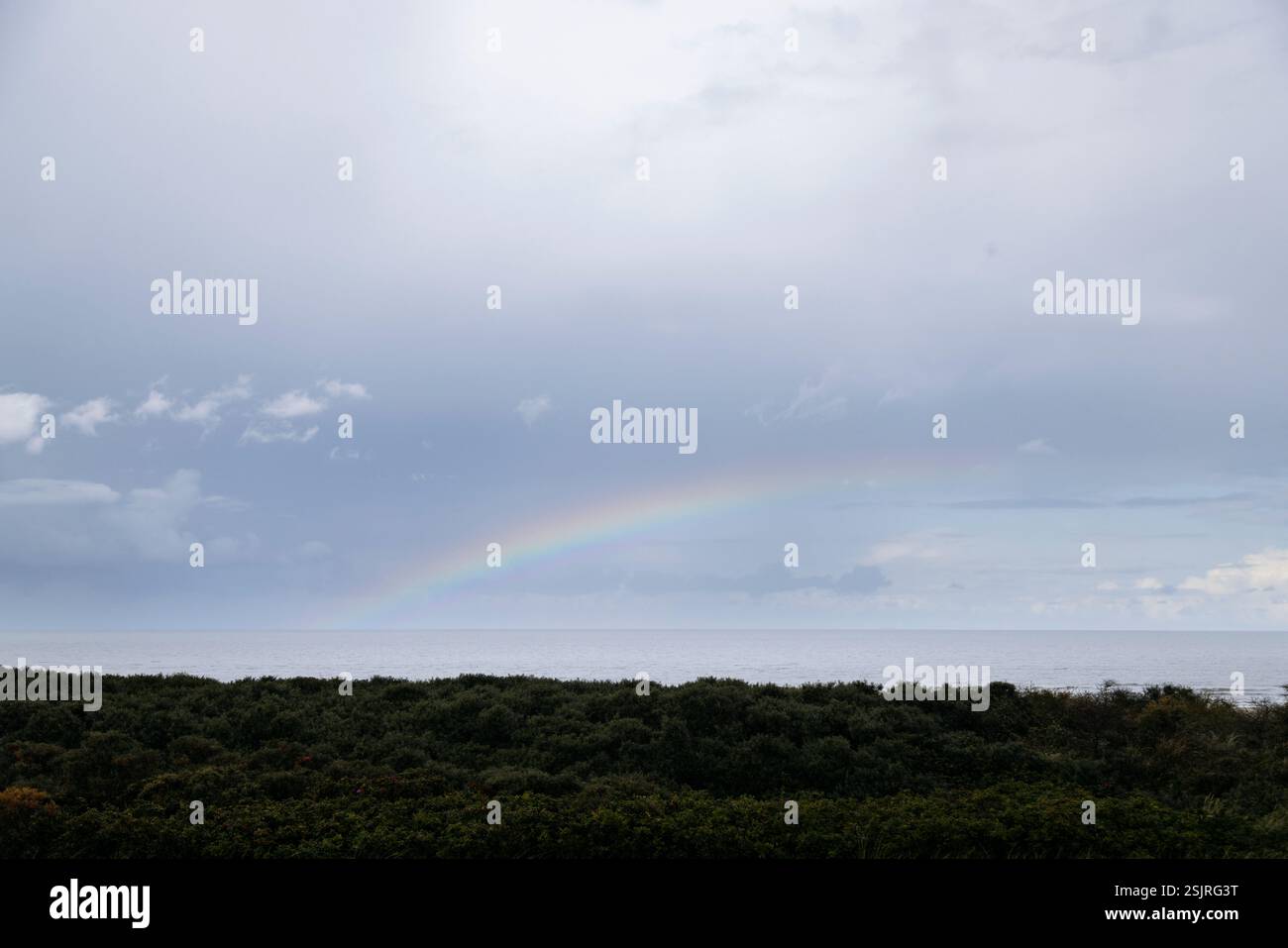 Rainbow in the sky over Juist Stock Photo