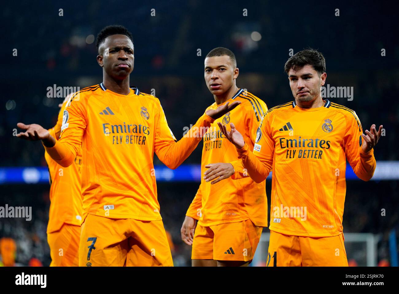 Real Madrid's Brahim Diaz (right) celebrates scoring their second goal of the game with teammate Kylian Mbappe (centre) during the UEFA Champions League Knockout Phase Play Offs, first leg match at the Etihad Stadium, Manchester. Picture date: Tuesday February 11, 2025. Stock Photo