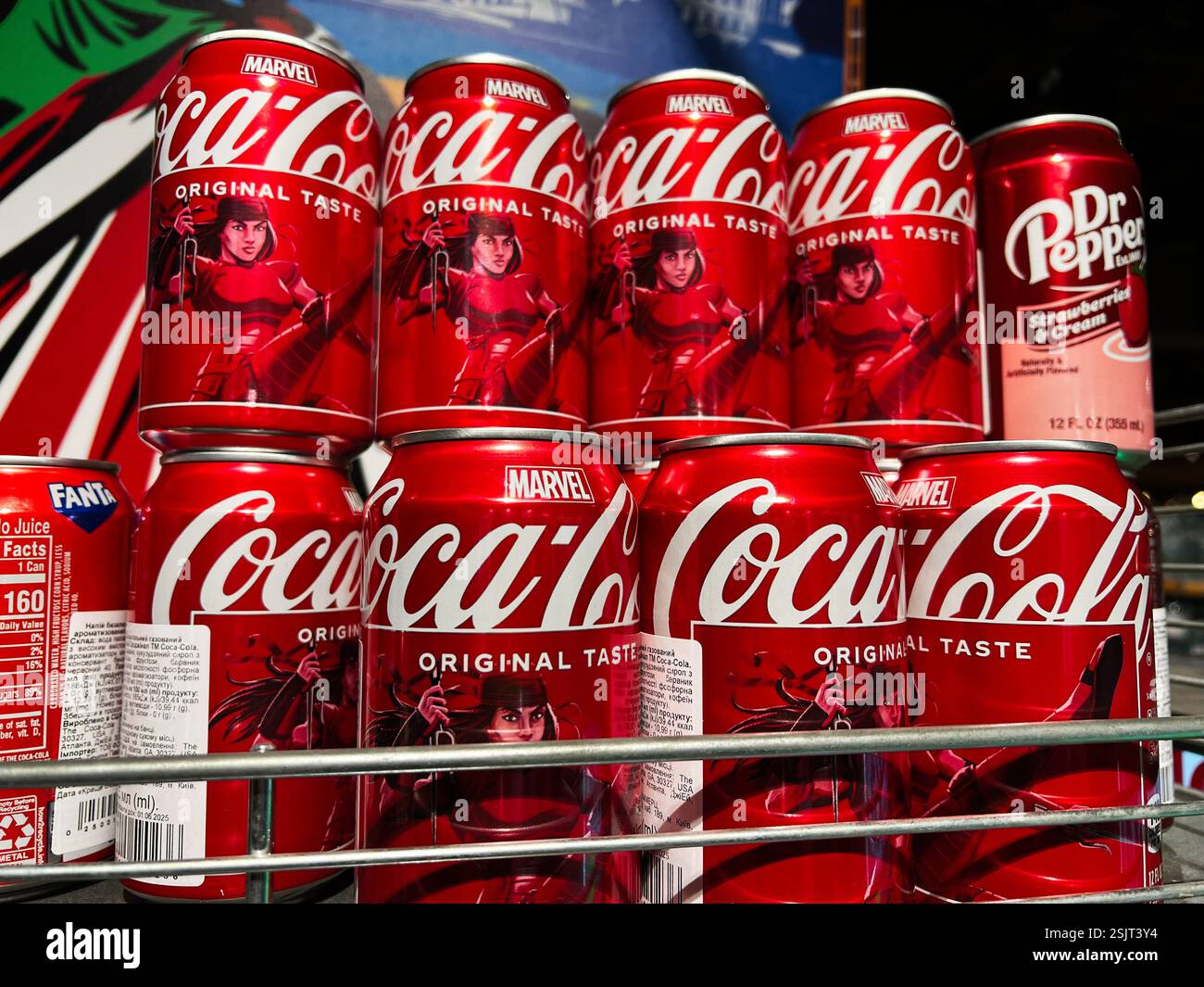 Kyiv Ukraine February 11 2025 A Variety Of Soda Cans Featuring Kyiv Ukraine February 11 2025 A Variety Of Soda Cans Featuring Coca Cola Original Taste And Marvel Branding 2SJT3Y4