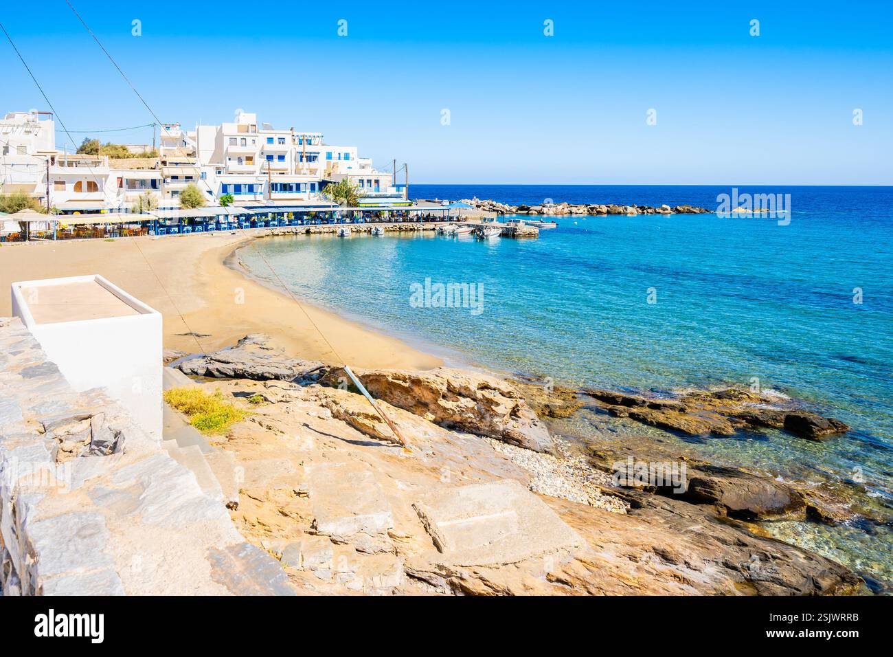 View of sandy beach in Apollonas village, Naxos island, Cyclades ...