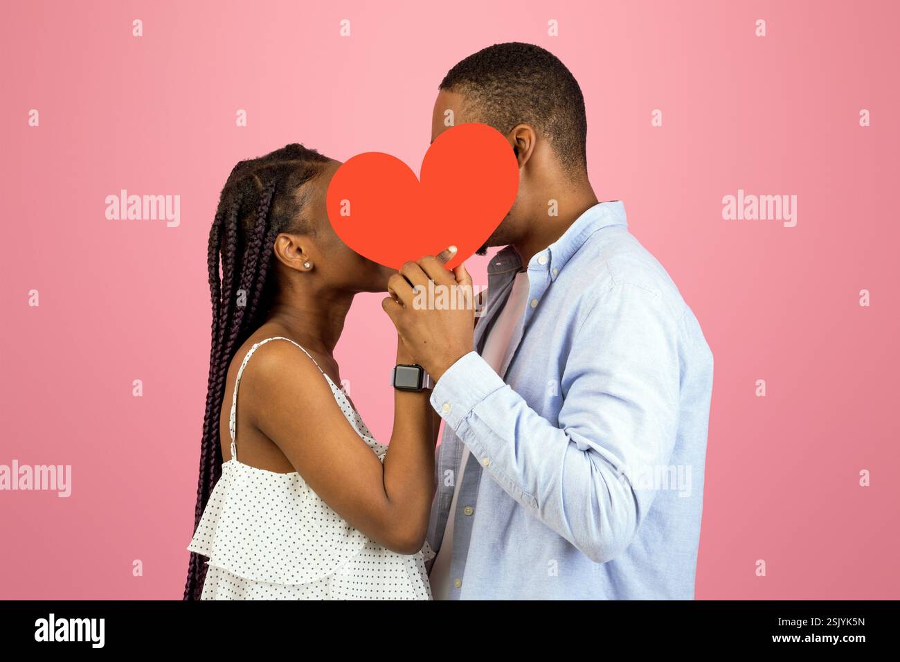 Young Romantic Black Couple Kissing Hiding Behind Red Paper Heart Stock ...