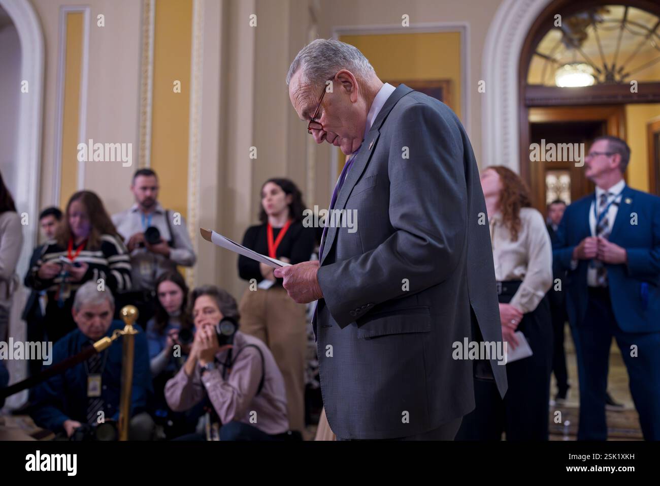 Senate Minority Leader Chuck Schumer, D-N.Y., looks over his notes as ...
